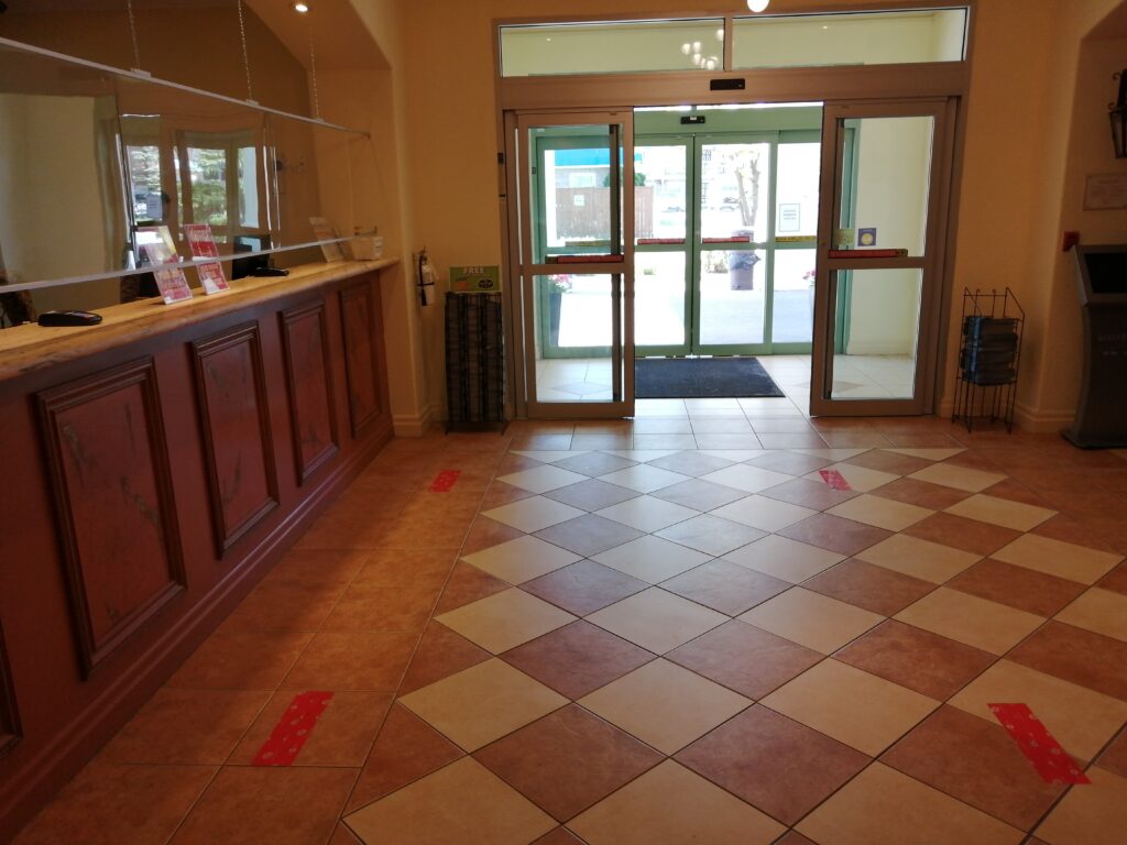 Hotels have added floor decals to show spacing requirements for social distancing